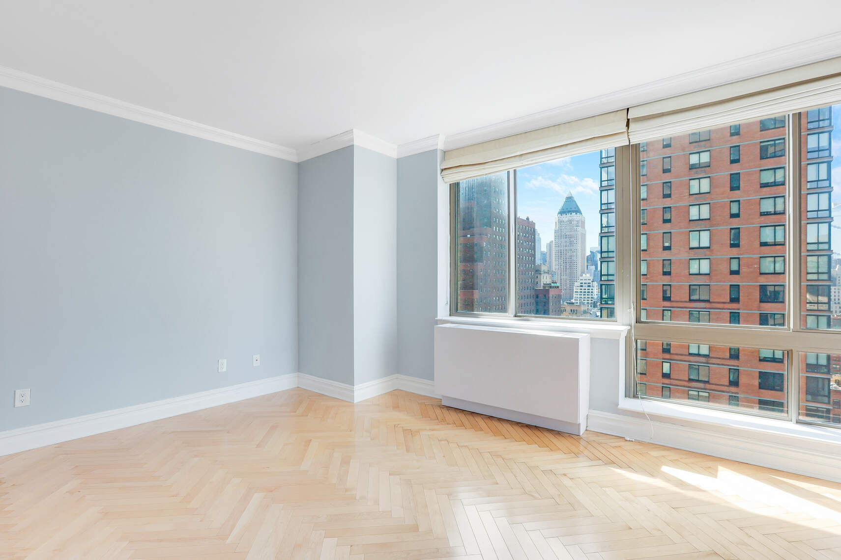 2 Columbus Avenue, Unit 17C Manhattan, NY 10023 - Photo 16 of 26 a view of an empty room with a window