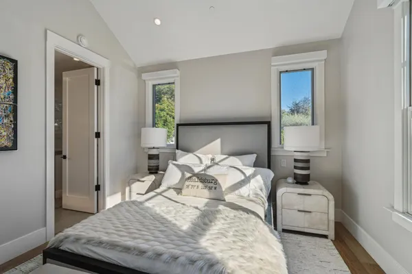 a bathroom with a granite countertop sink a toilet and a shower curtain