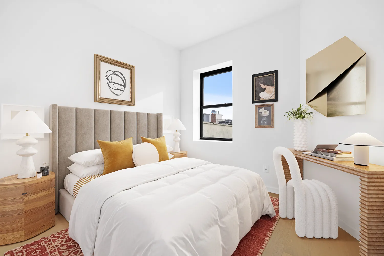 a bedroom with bed and a painting on the wall