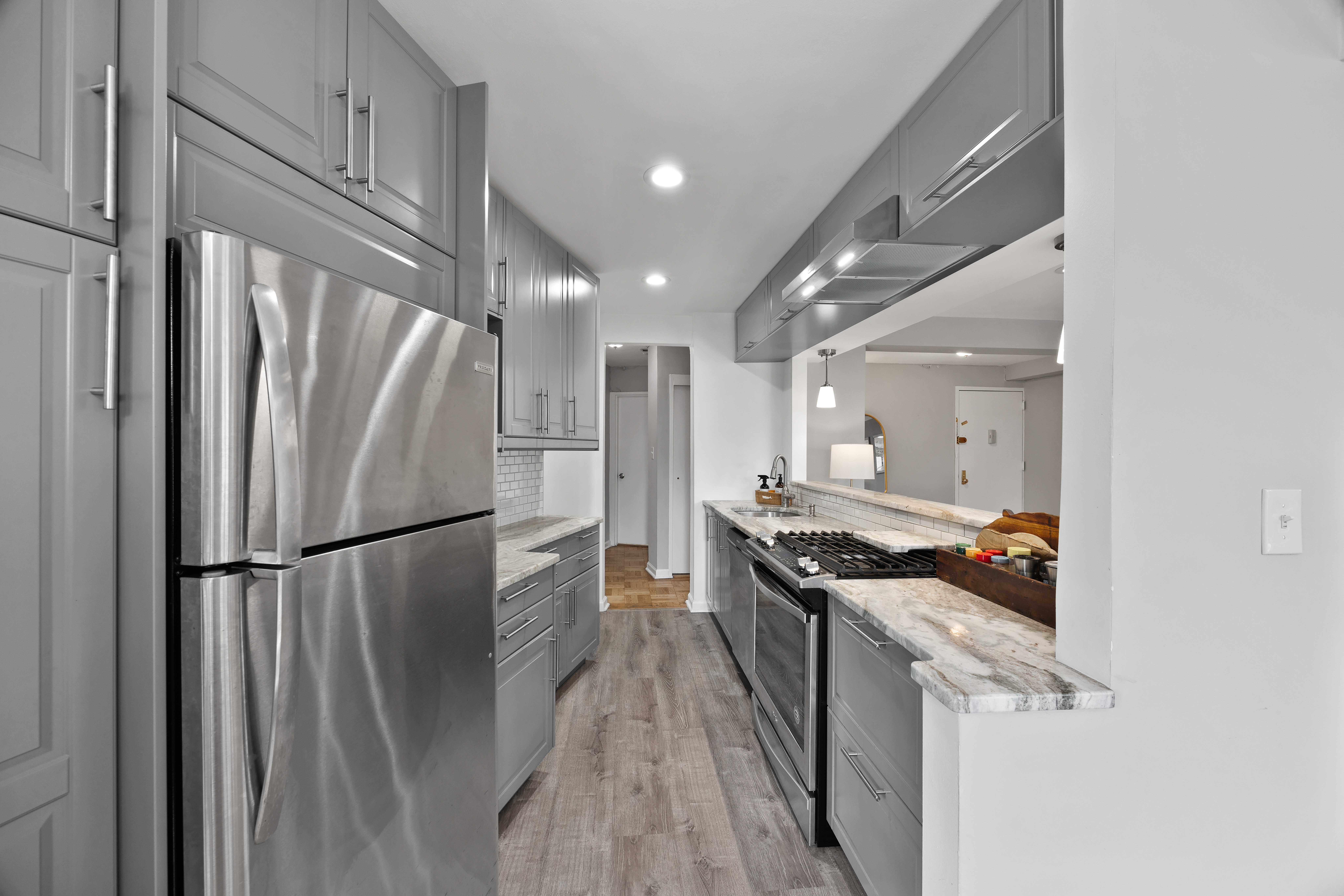 255 Fieldston Terrace, Unit 2L Bronx, NY 10471 - Photo 10 of 32 a kitchen with stainless steel appliances granite countertop a refrigerator a stove and a refrigerator
