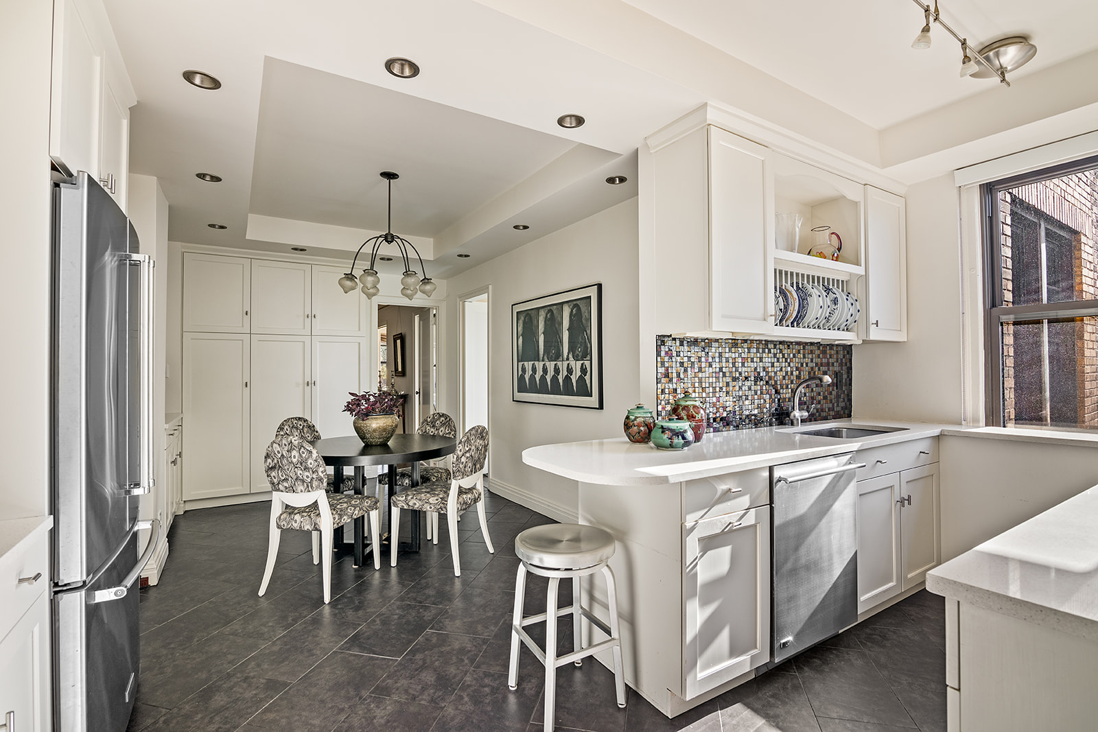 9 Prospect Park West, Unit 5C Brooklyn, NY 11215 - Photo 3 of 9 a view of a dining room kitchen with furniture and chandelier