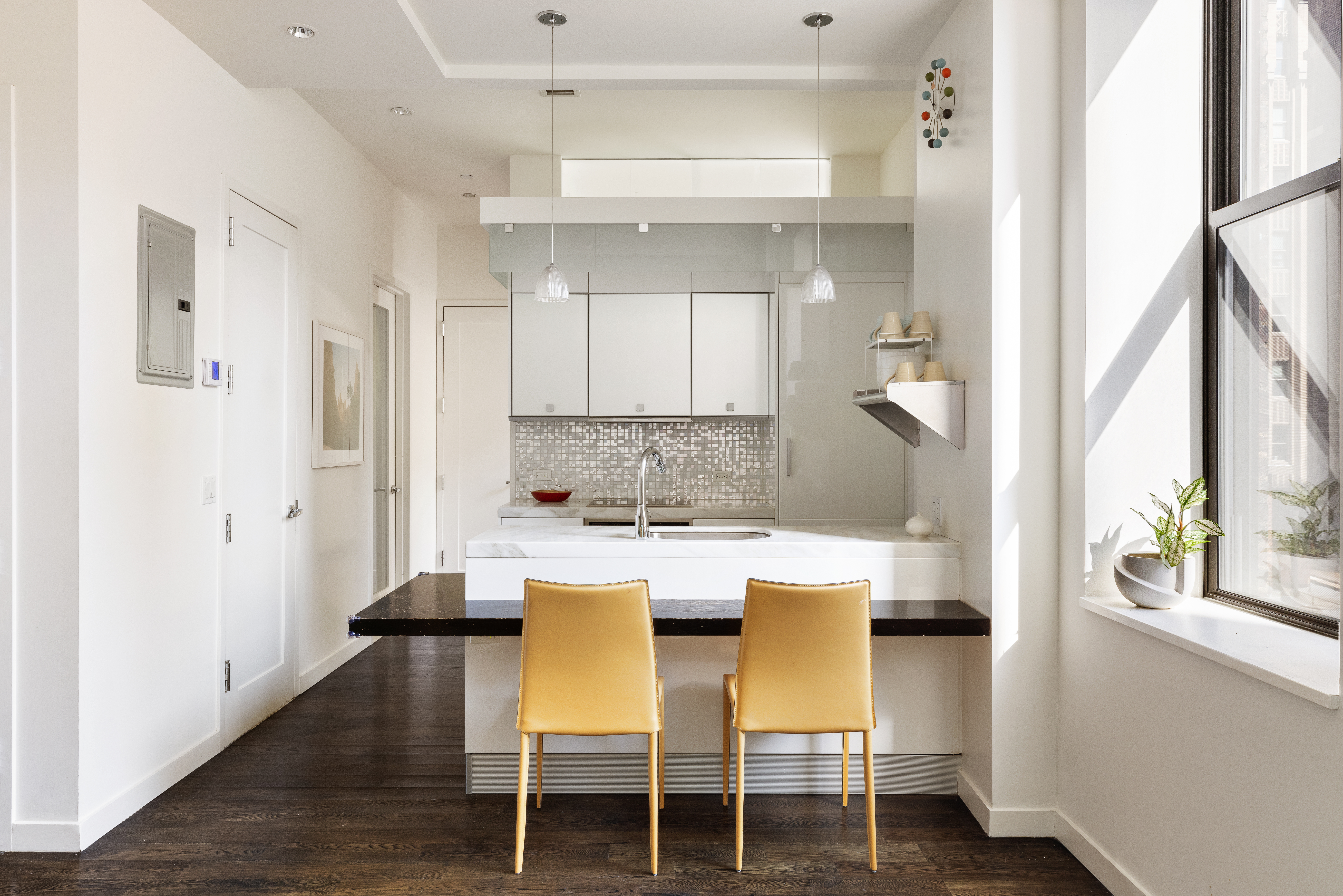 11 East 36th Street, Unit 605 Manhattan, NY 10016 - Photo 1 of 6 a view of a dining room with furniture and a window
