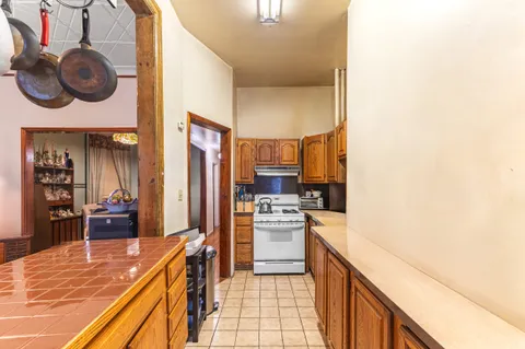a kitchen with a stove and a refrigerator