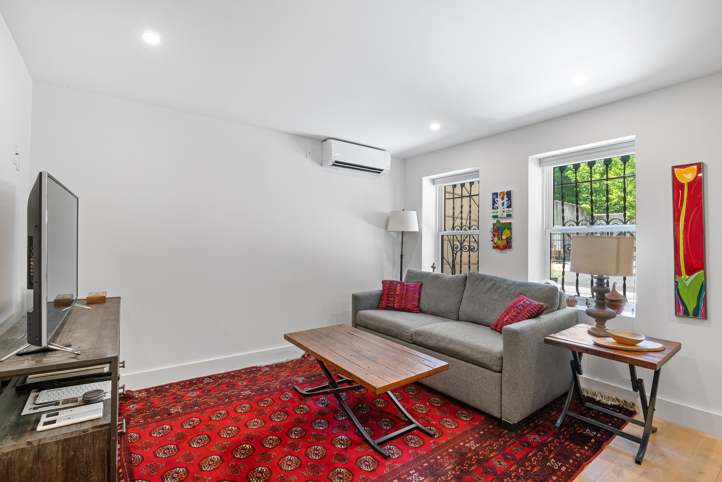 5 Hampton Place Brooklyn, NY 11213 - Photo 17 of 24 a living room with furniture and a flat screen tv