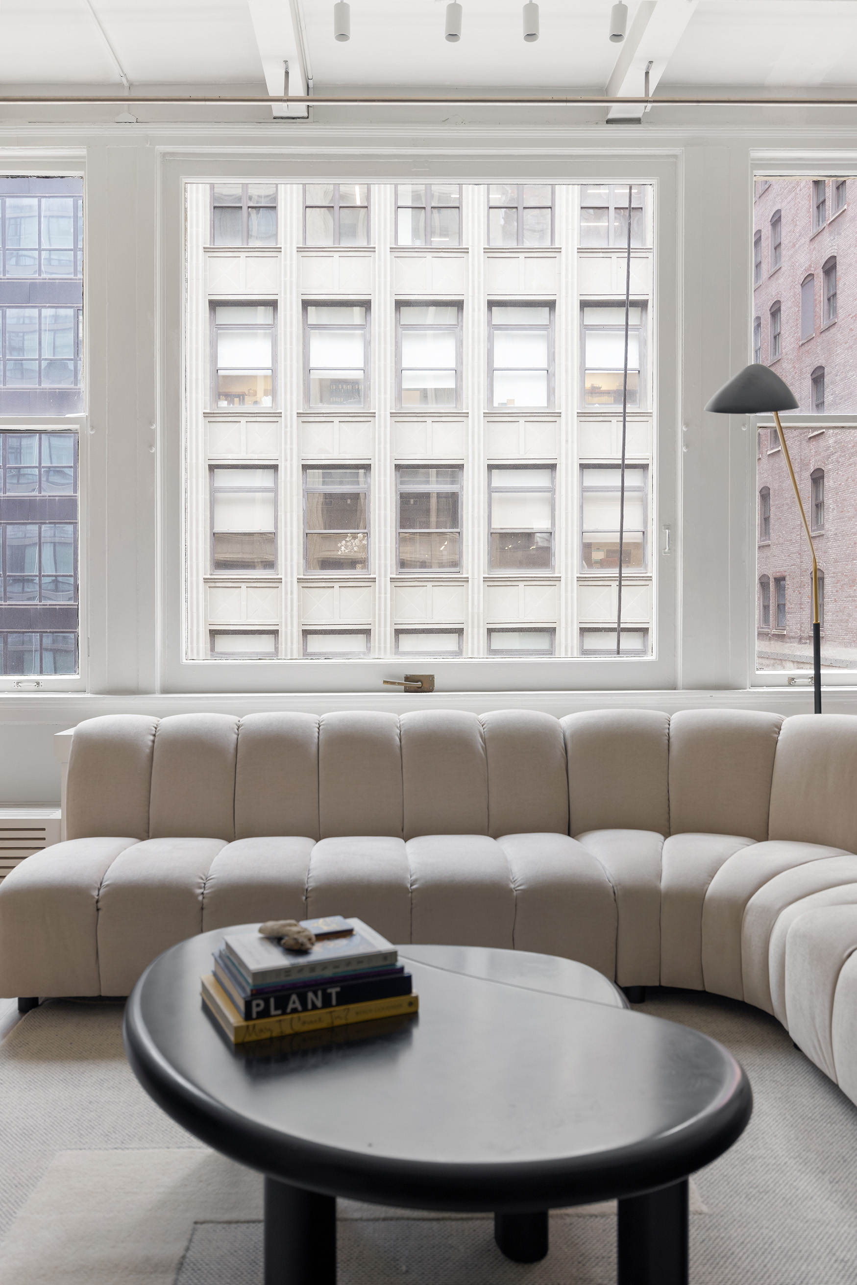 28 West 38th Street, Unit 6E Manhattan, NY 10018 - Photo 2 of 15 a living room with furniture and a window