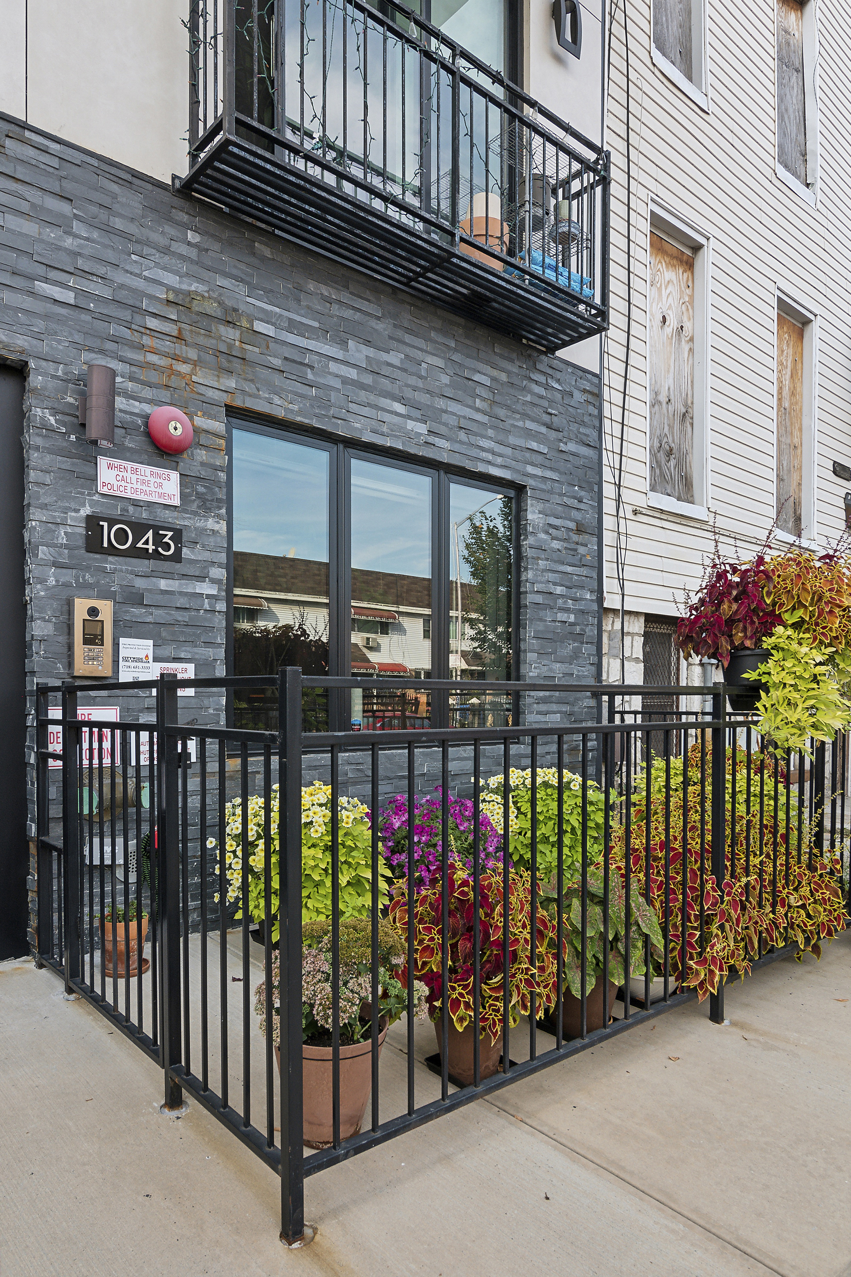 1043 Halsey Street, Unit 1 Brooklyn, NY 11207 - Photo 13 of 14 a view of a street with sitting area