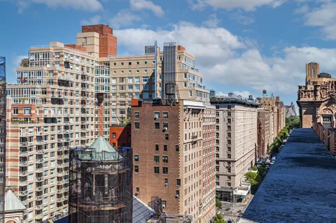 a view of a city with tall buildings