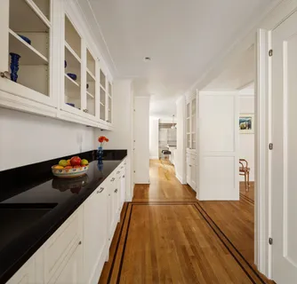 a kitchen with stainless steel appliances a sink and cabinets