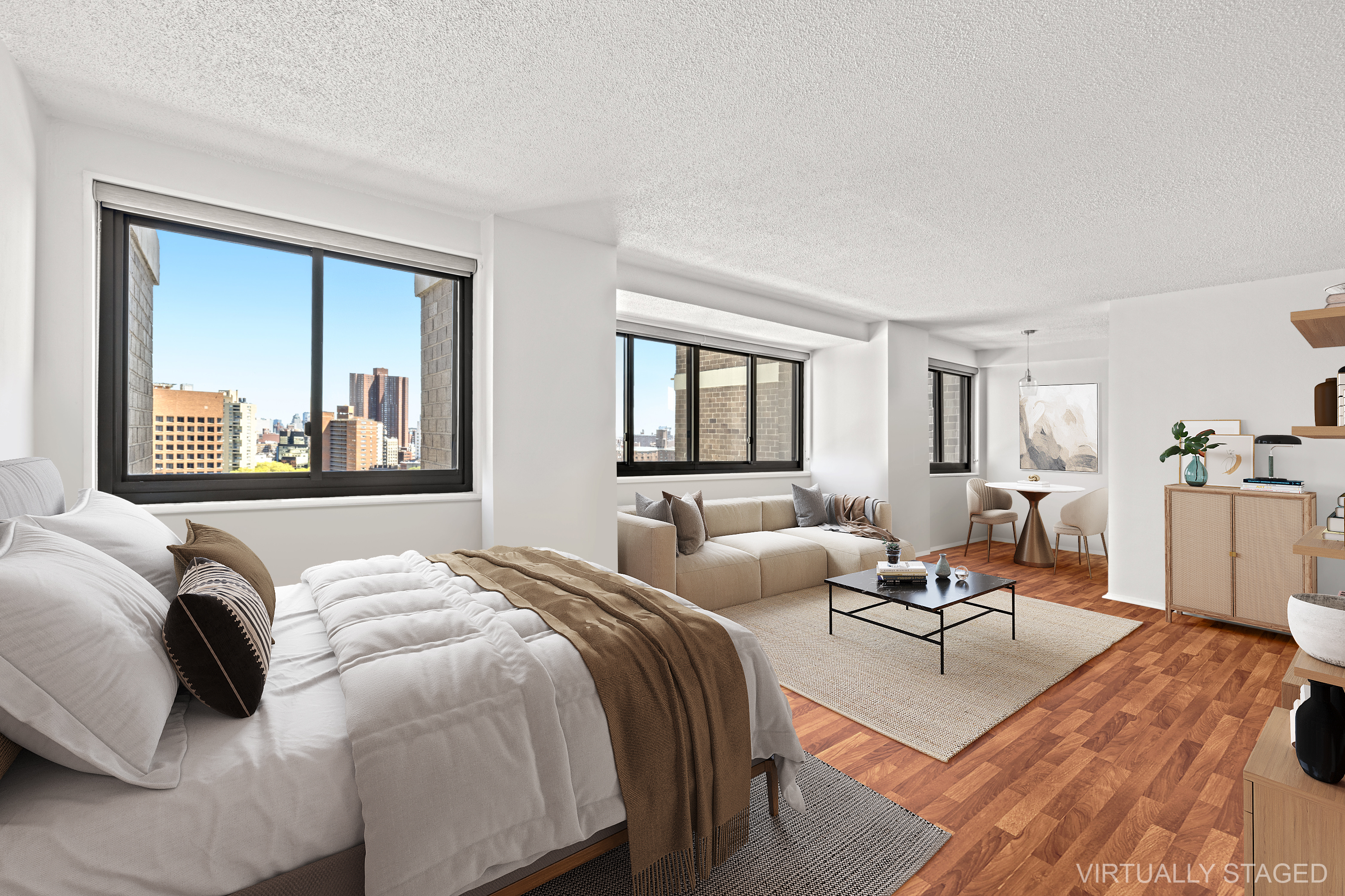 a bedroom with two beds and a large mirror next to a window