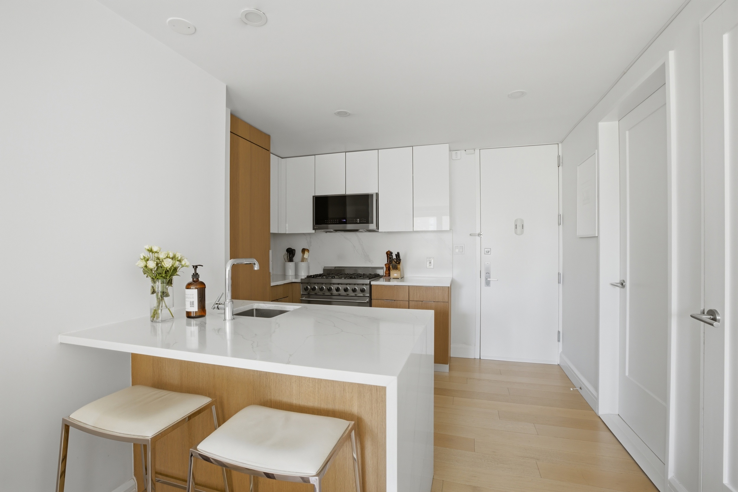 175 West 95th Street, Unit 8H Manhattan, NY 10025 - Photo 4 of 13 a kitchen with a sink cabinets and appliances
