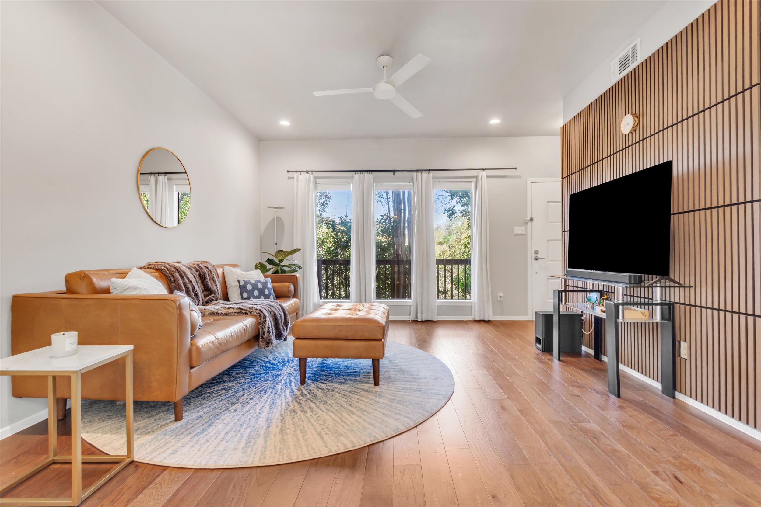 3601 Las Colinas Drive, Unit C Austin, TX 78731 - Photo 12 of 33 a living room with furniture and a flat screen tv