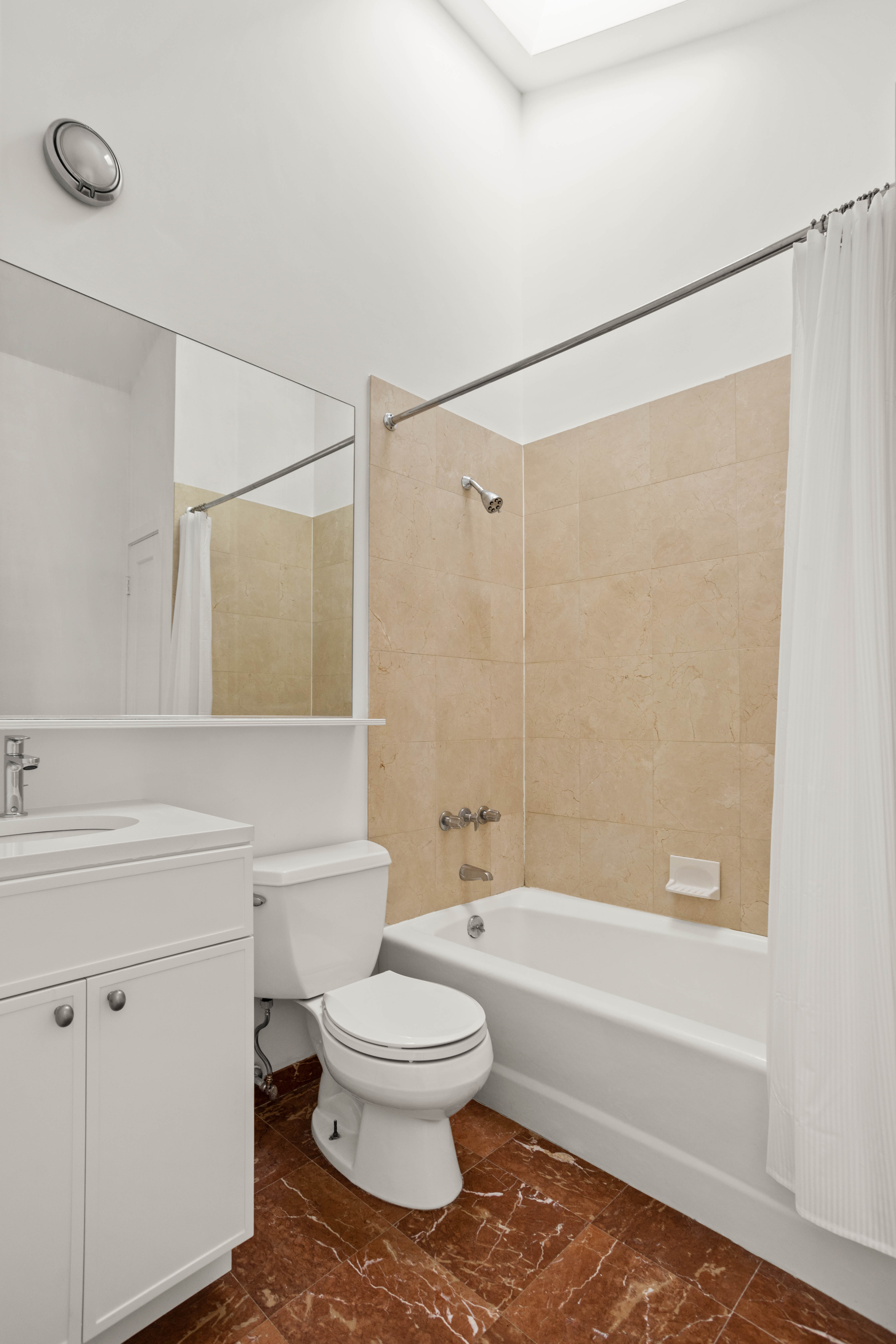 357 West 20th Street, Unit B Manhattan, NY 10011 - Photo 8 of 10 a bathroom with a toilet and a bathtub