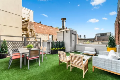 a view of a patio with a yard