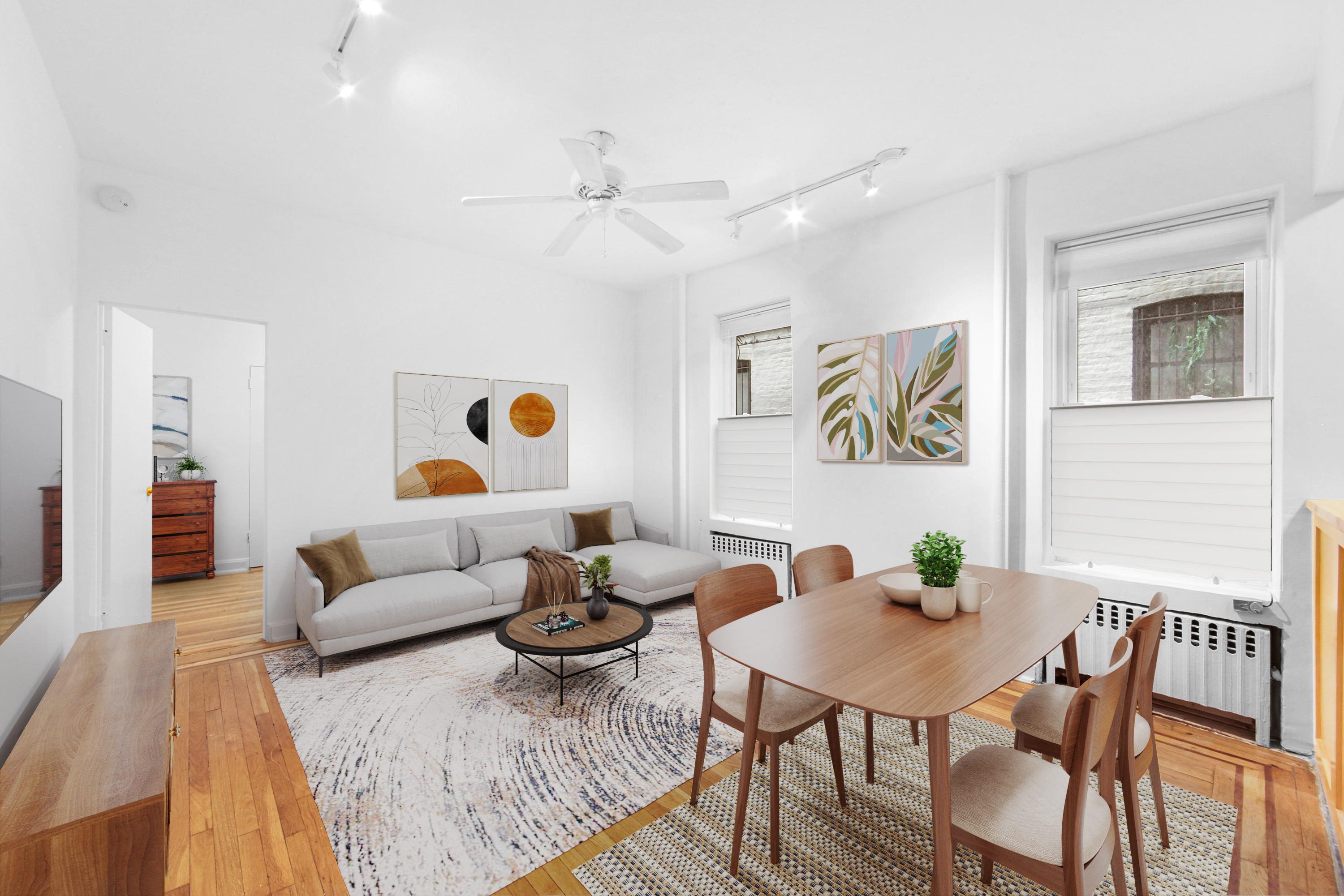 a living room with furniture and wooden floor