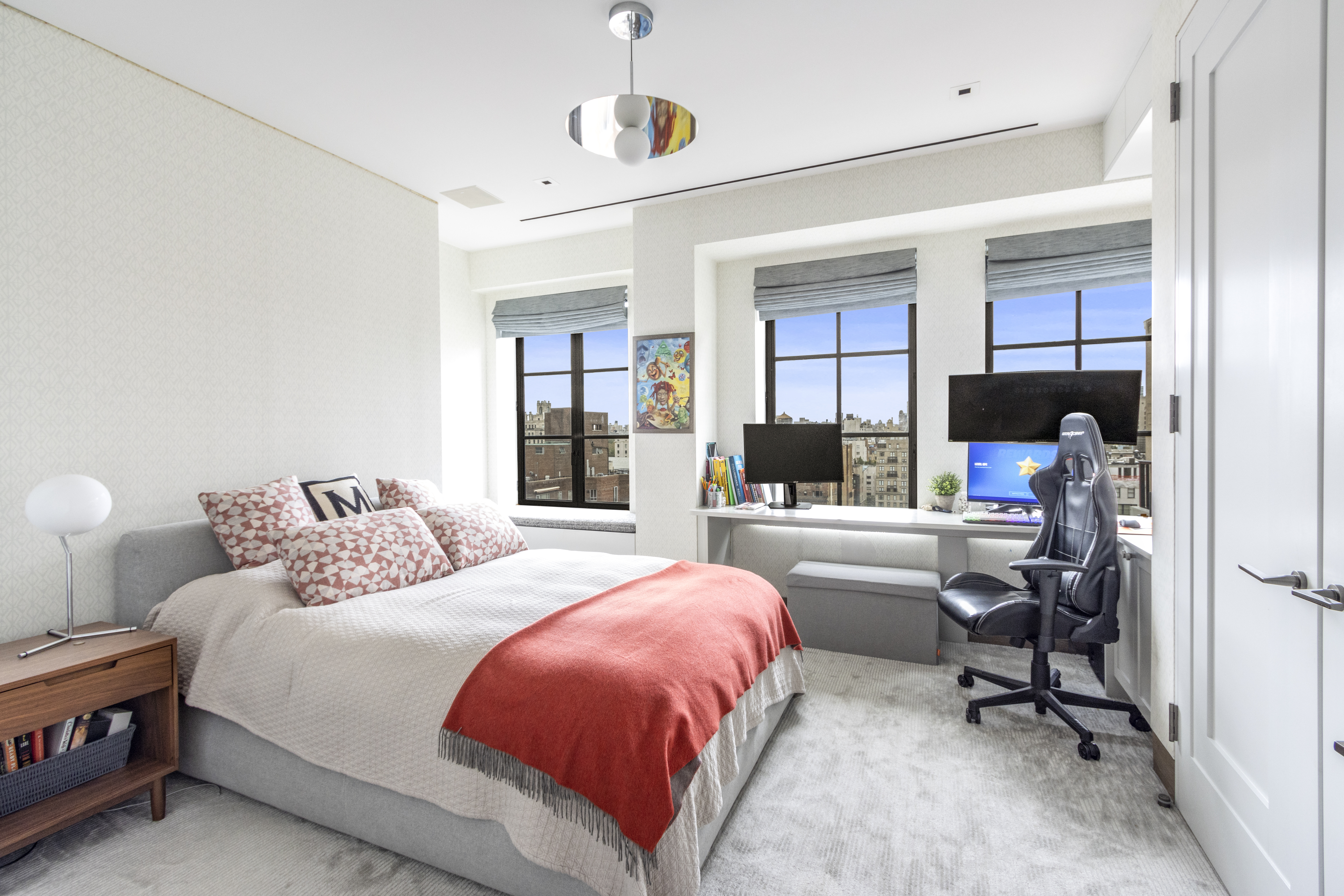 40 East 61st Street, Unit 18A Manhattan, NY 10065 - Photo 12 of 15 a bedroom with a large bed and a window