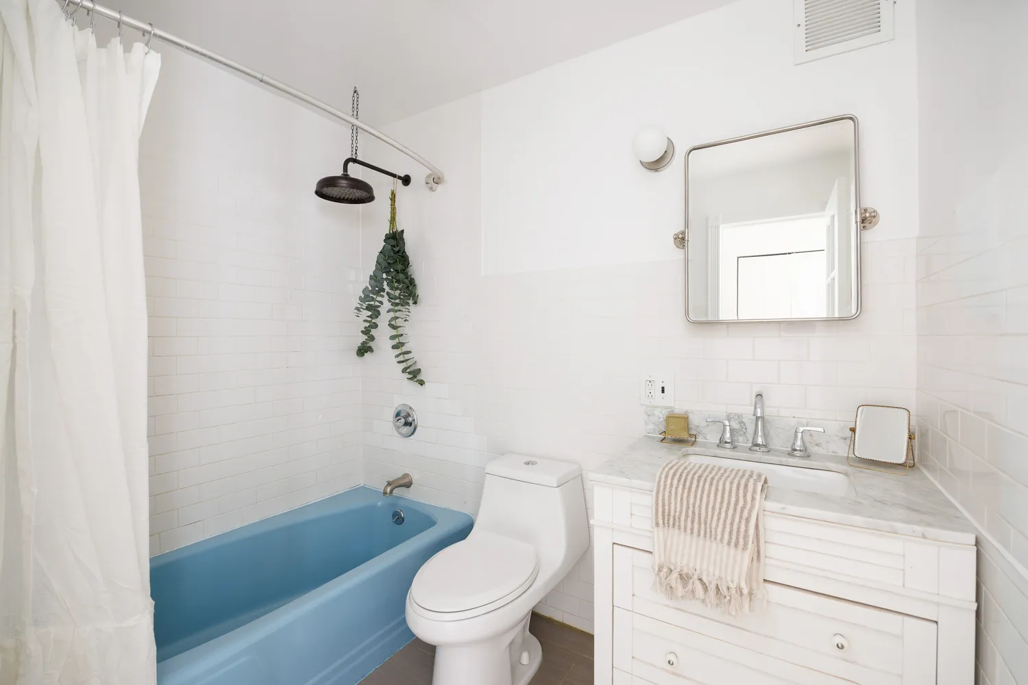 a bathroom with a sink a toilet and a bathtub