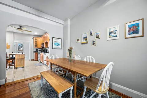 a kitchen with stainless steel appliances granite countertop a stove a sink dishwasher and a refrigerator