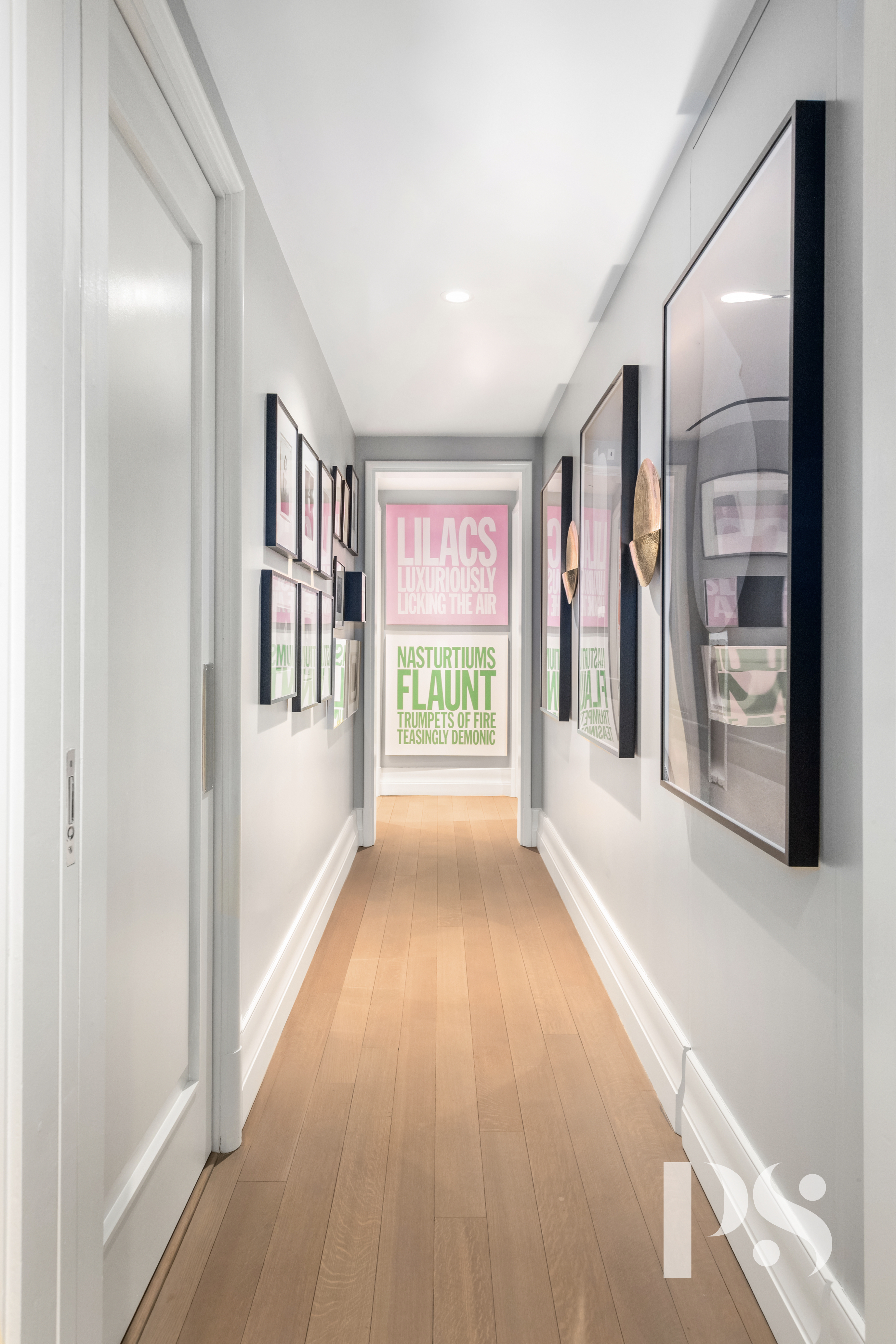 135 East 79th Street, Unit 8E Manhattan, NY 10075 - Photo 14 of 26 a view of a hallway with wooden floor and windows