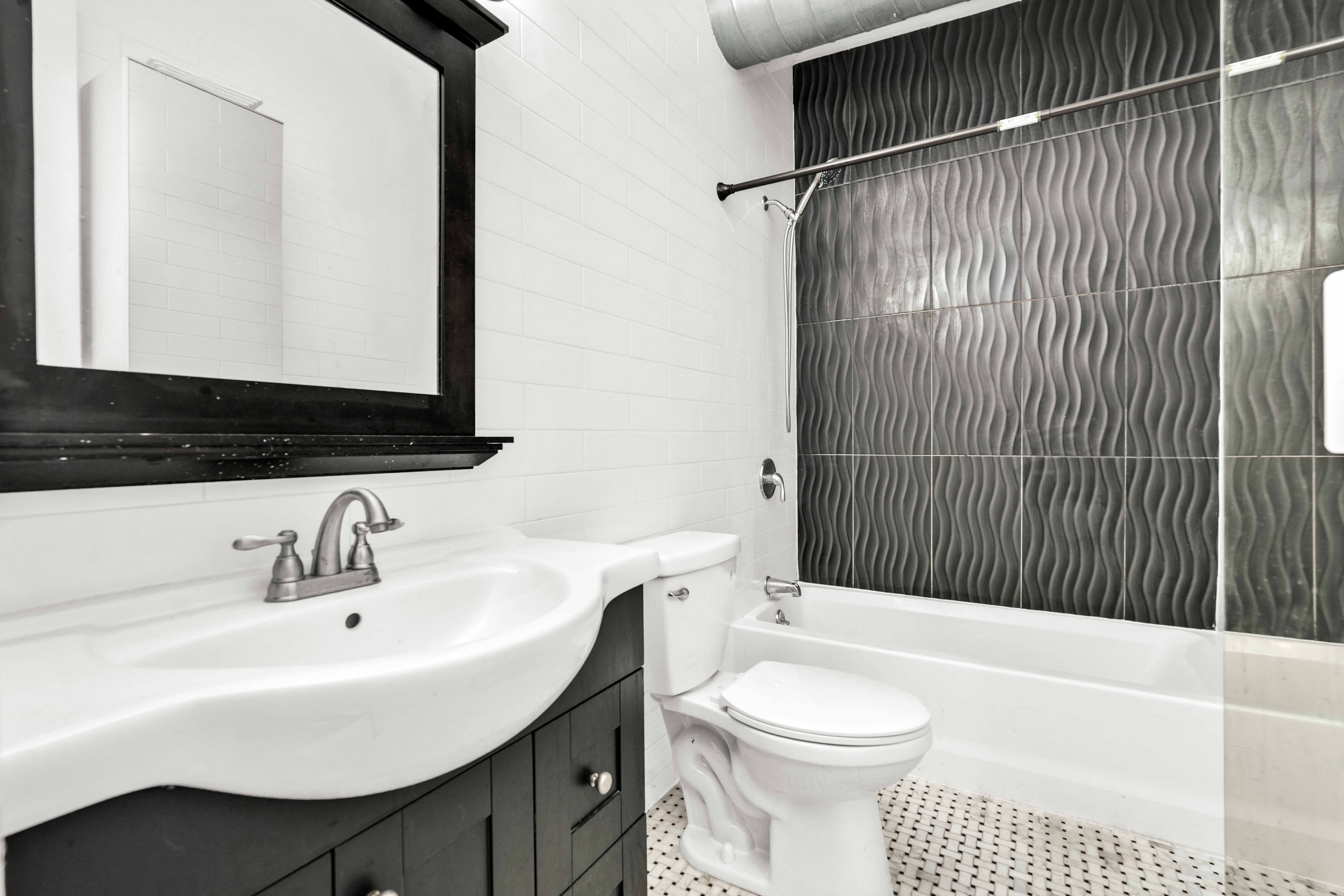 17 A Suydam Place, Unit 2 Brooklyn, NY 11233 - Photo 17 of 28 a bathroom with a sink a toilet and shower