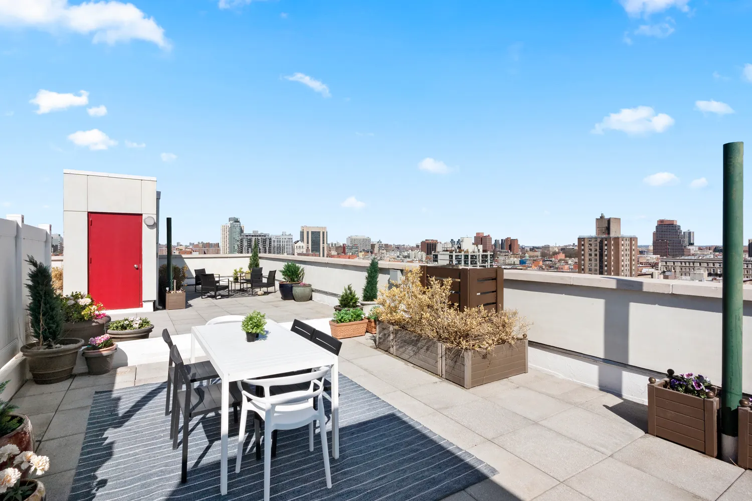 a view of a terrace with furniture and a kitchen