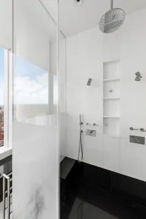 a room with a table chairs and wooden floor