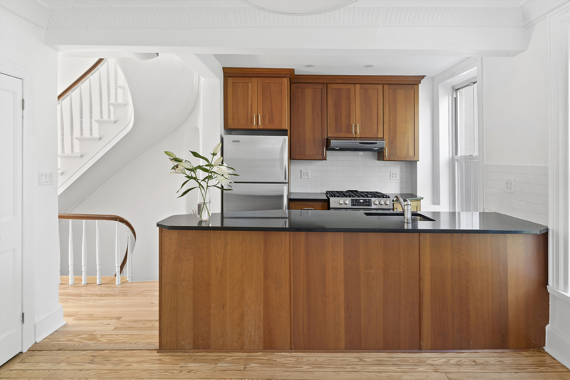 237 Bergen Street, Unit 2 Brooklyn, NY 11217 - Photo 1 of 11 a living room with stainless steel appliances granite countertop furniture a rug and a window