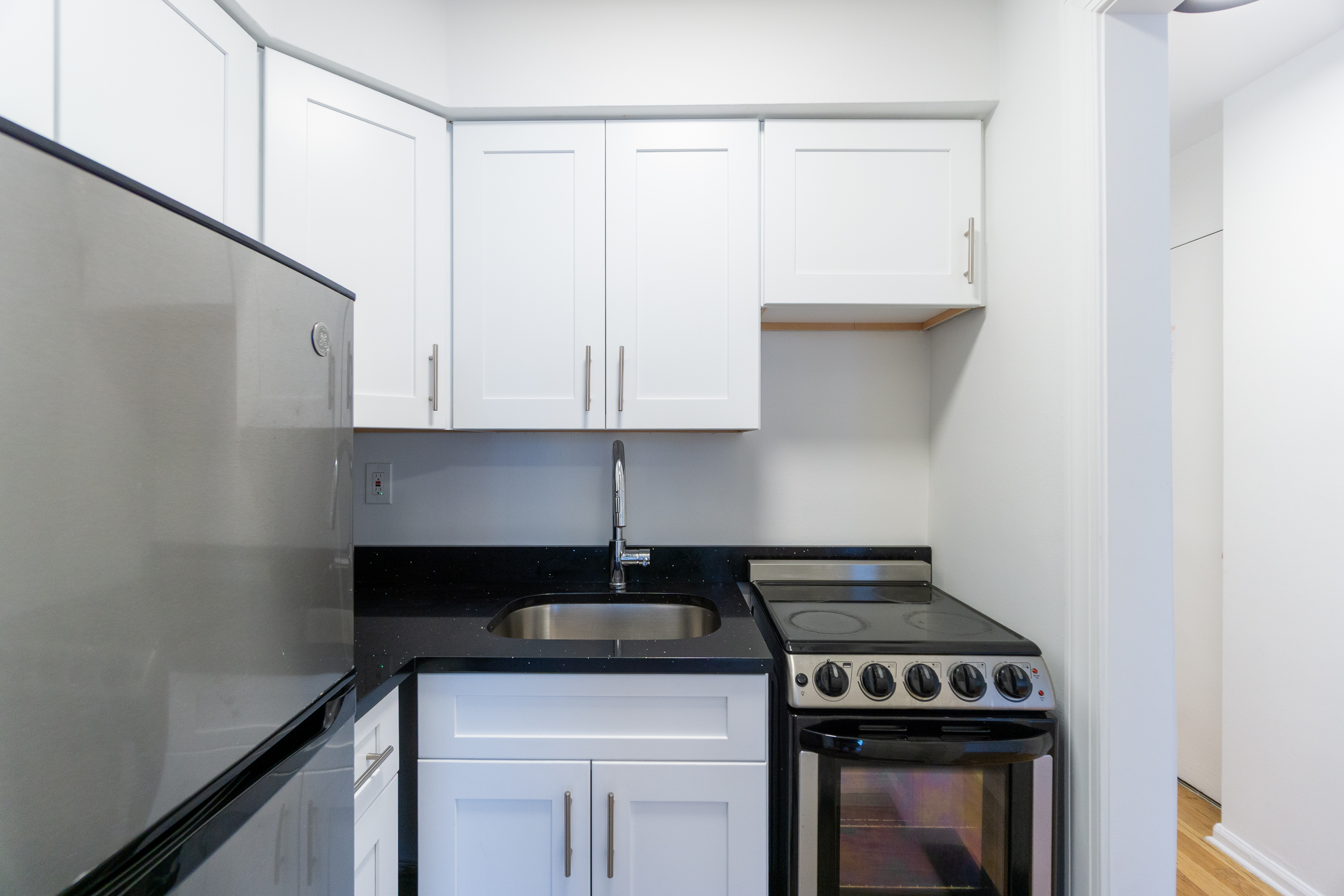 205 2nd Avenue, Unit 4A Manhattan, NY 10003 - Photo 4 of 13 a stove top oven sitting inside of a kitchen