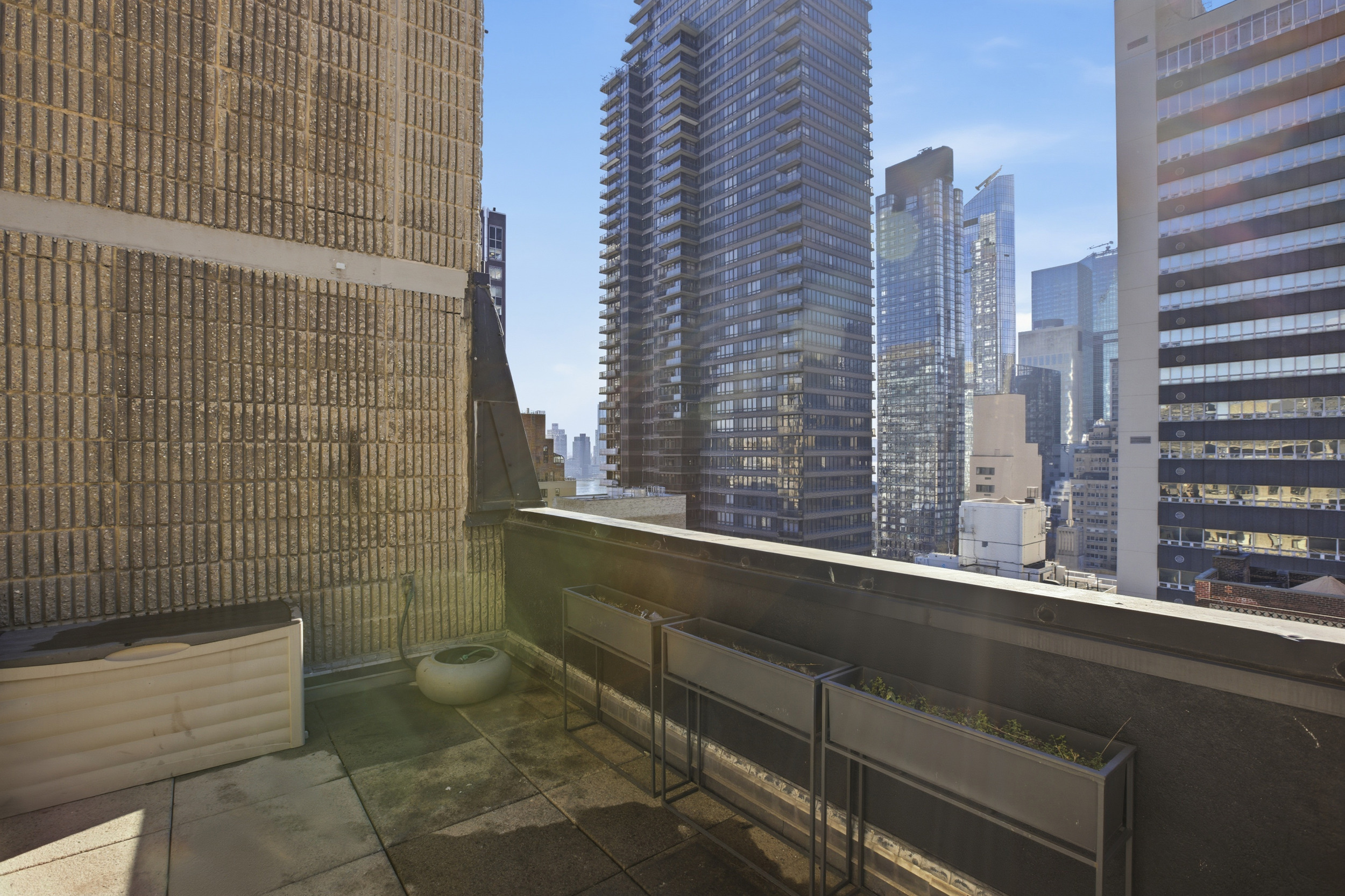 309 East 49th Street, Unit 21A Manhattan, NY 10017 - Photo 15 of 18 a bathroom with a toilet and a shower