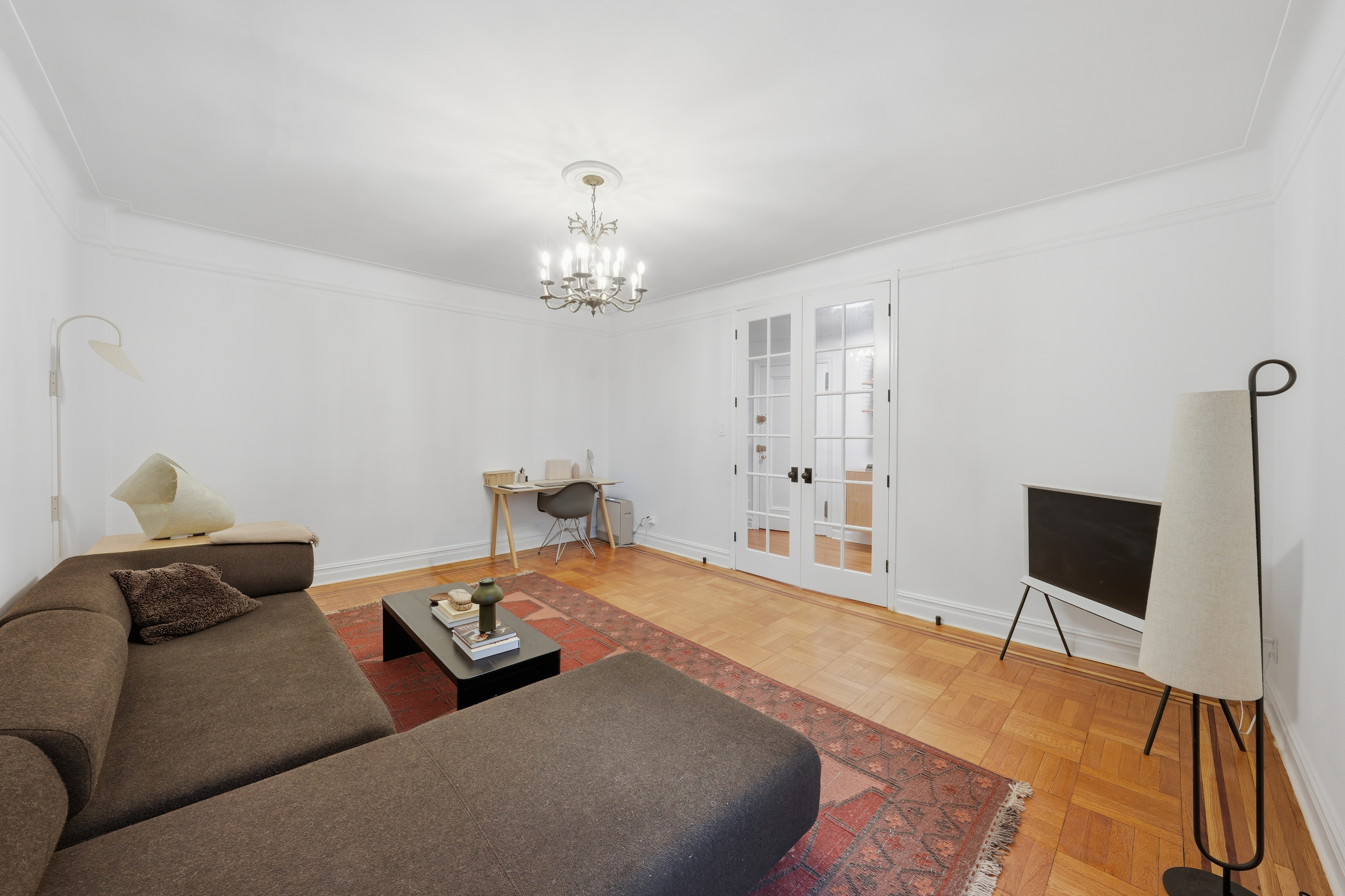 80 Avenue P, Unit D14 Brooklyn, NY 11204 - Photo 5 of 19 a bedroom with furniture and a chandelier