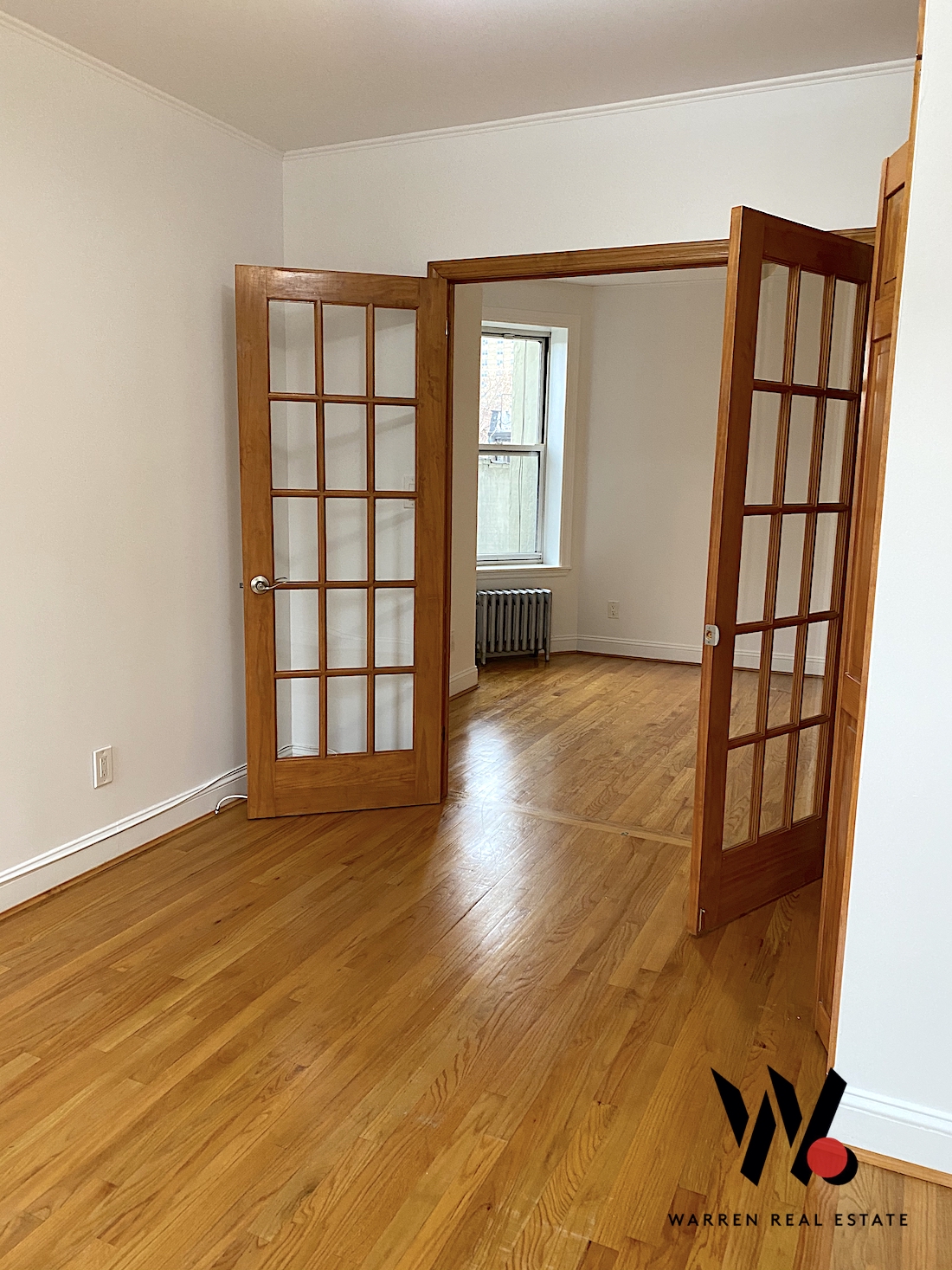 80 East 7th Street, Unit 4D Manhattan, NY 10003 - Photo 1 of 8 wooden floor in an empty room with a window