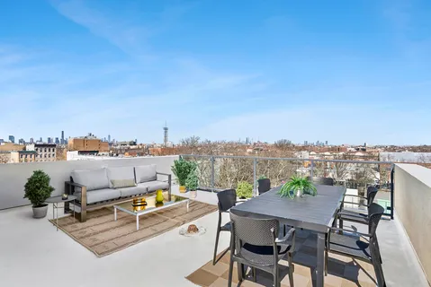 a view of a terrace with furniture and a terrace view