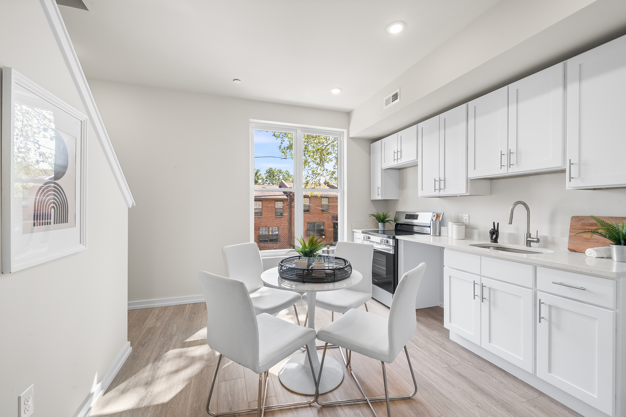 534 North 54th Street, Unit A Philadelphia, PA 19131 - Photo 5 of 22 a kitchen with a table and chairs in it