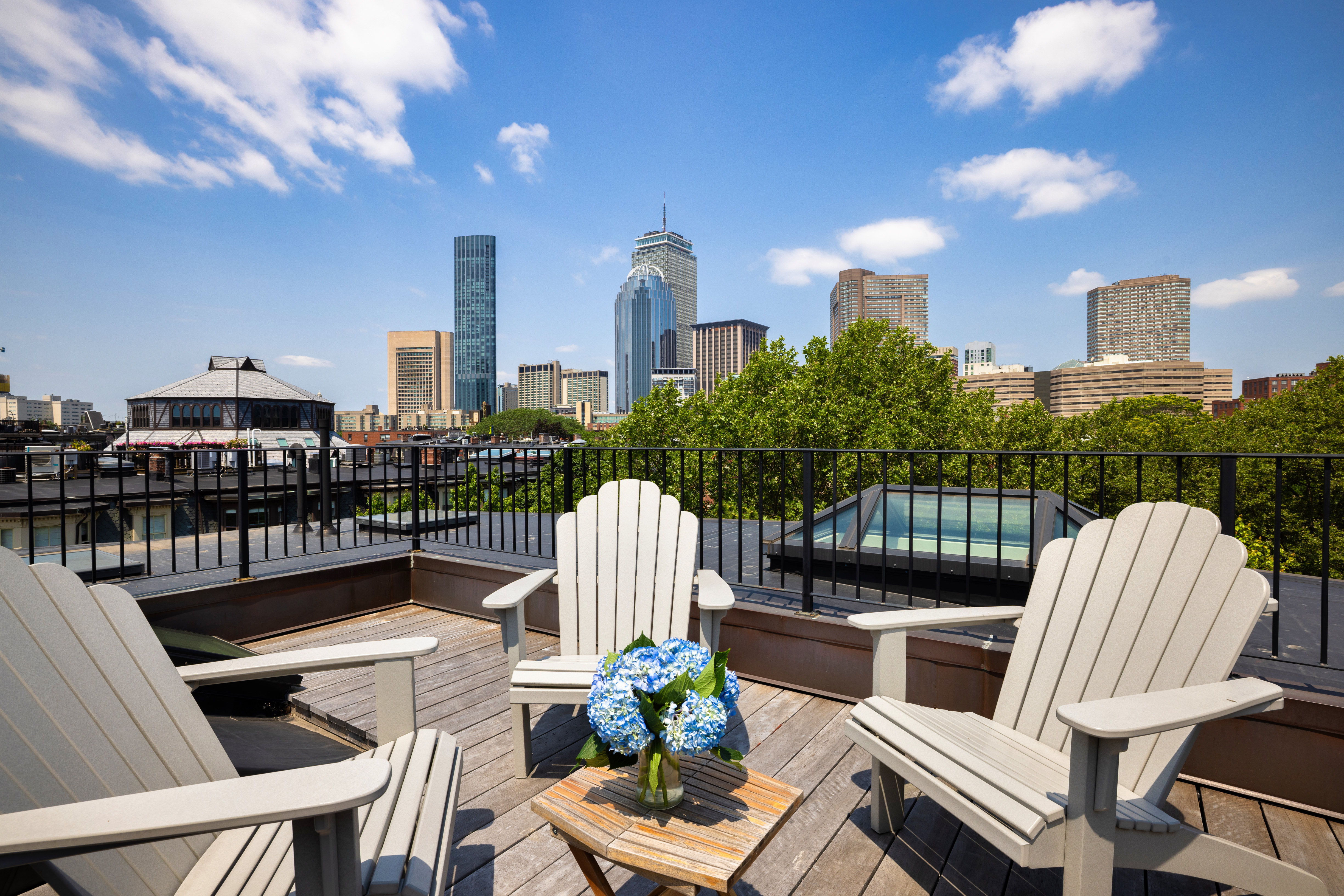 South End Boston, MA 02118 - Photo 22 of 24 a view of a patio with couches table and chairs and potted plants