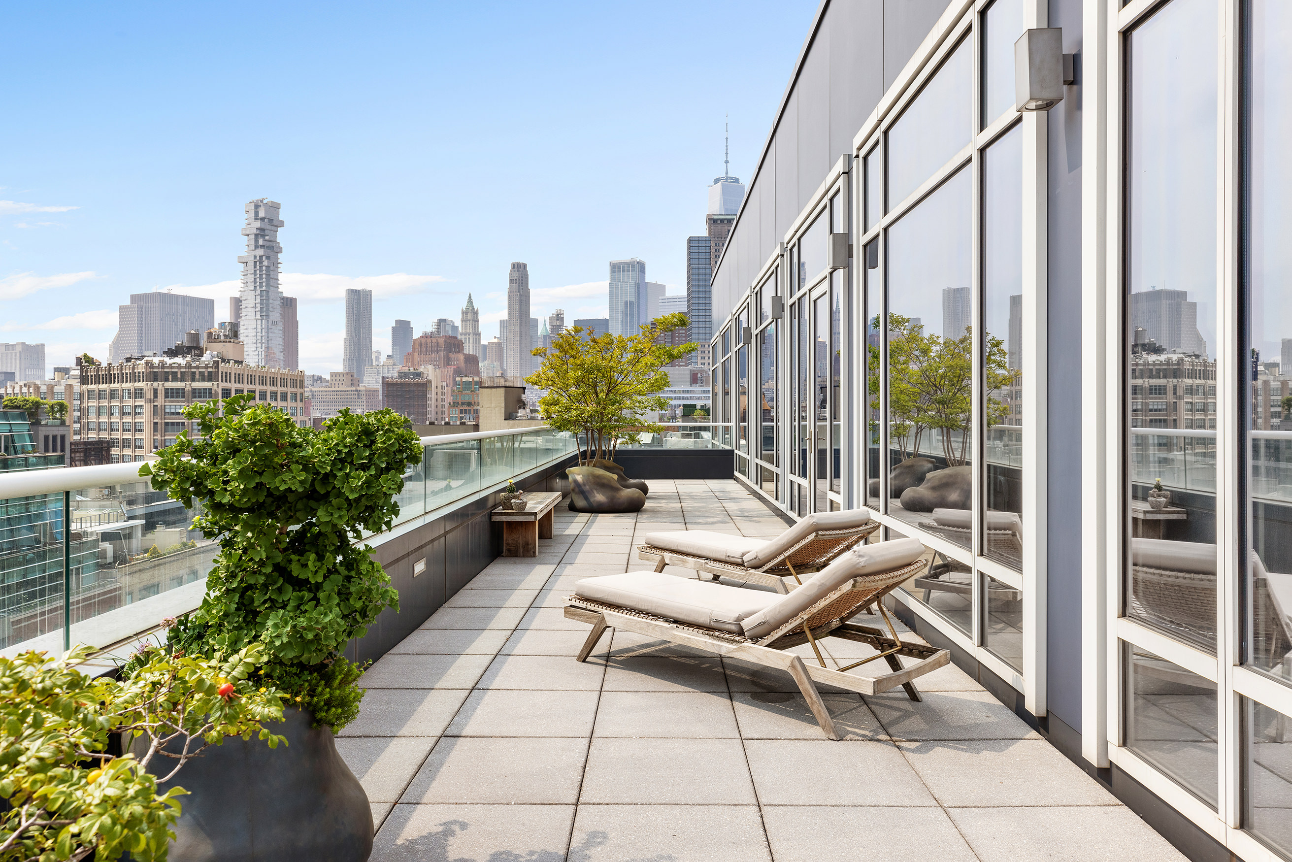 330 Spring Street, Unit PH Manhattan, NY 10013 - Photo 16 of 23 a terrace with outdoor seating and city view