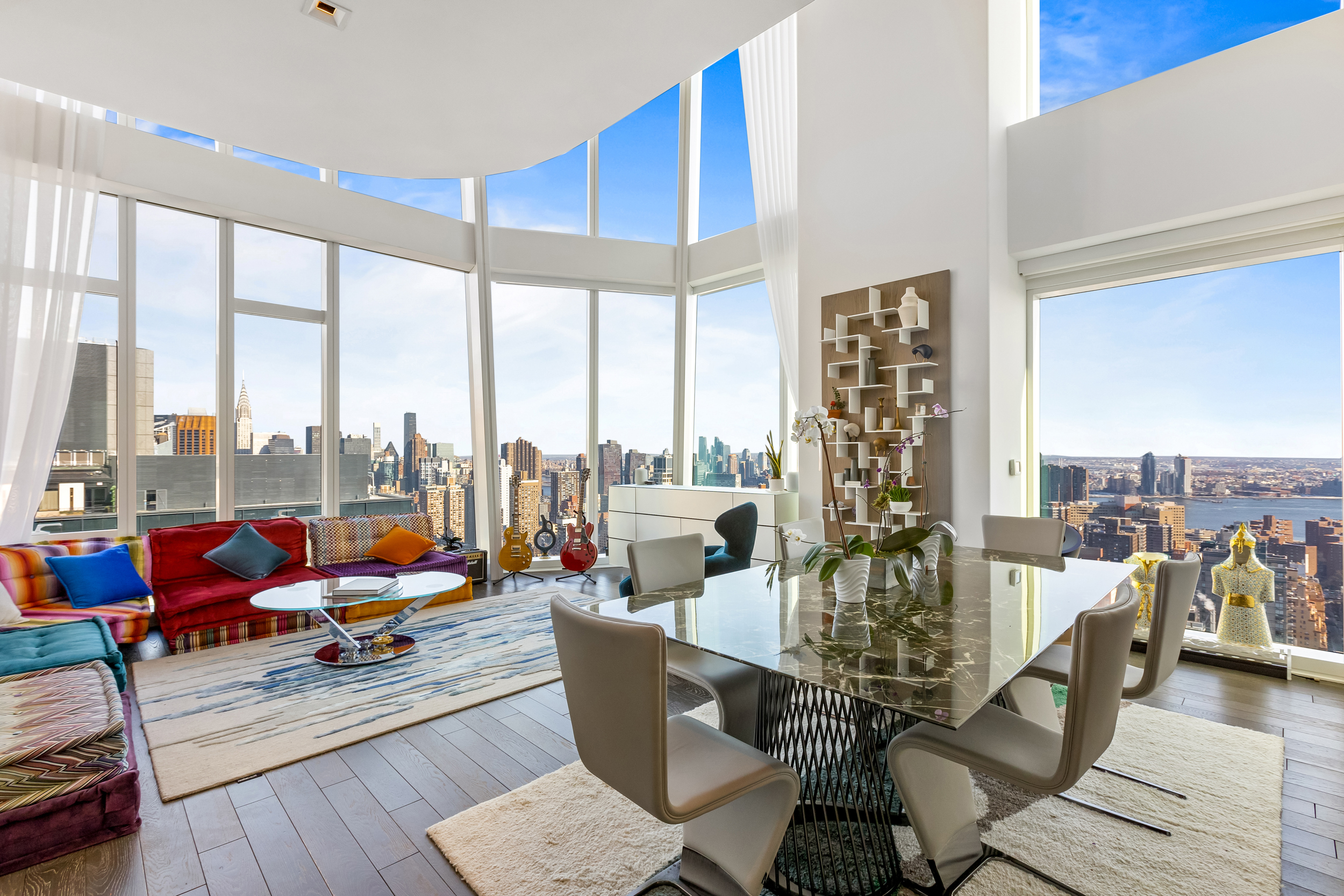 45 East 22nd Street, Unit 42B Manhattan, NY 10010 - Photo 1 of 23 a living room with patio furniture and a floor to ceiling window
