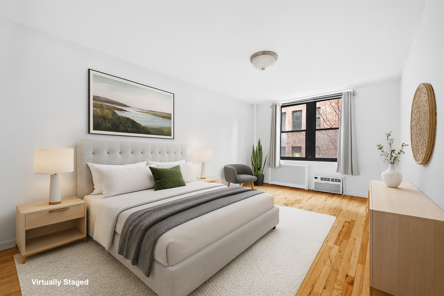 a spacious bedroom with a bed and a couch