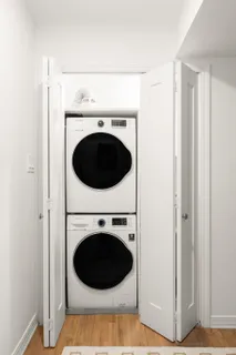a view of a hallway with washer and dryer
