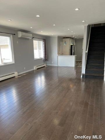 204-11 46th Avenue Queens, NY 11361 - Photo 3 of 7 an empty room with wooden floor and windows