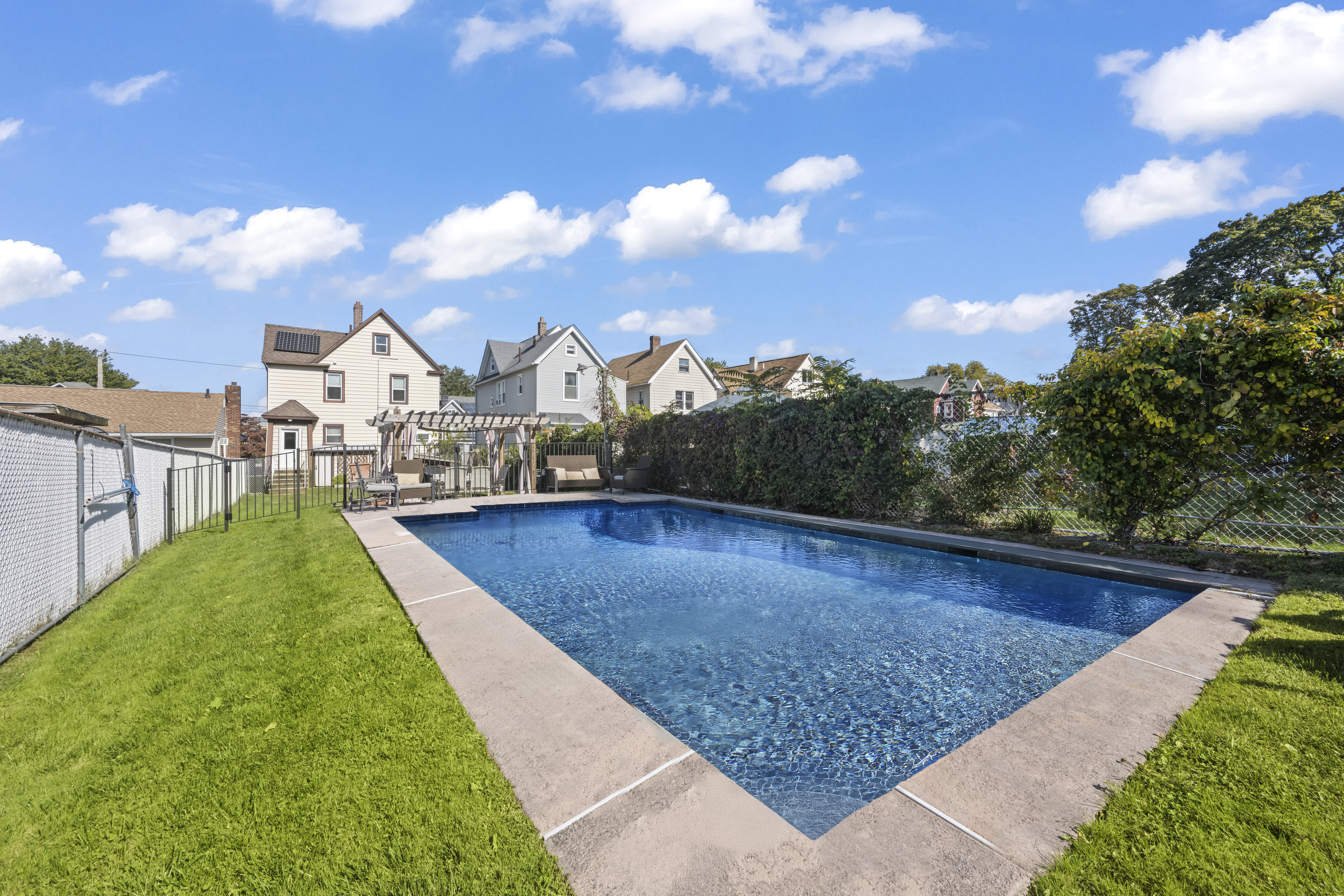 704 Delafield Avenue Staten Island, NY 10310 - Photo 26 of 35 a view of a swimming pool with a yard