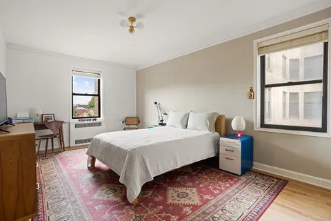 a bed room with a bed and a window