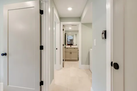 a bedroom with two beds and painted walls