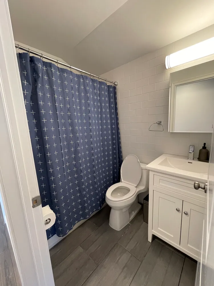 a bathroom with a toilet and a sink