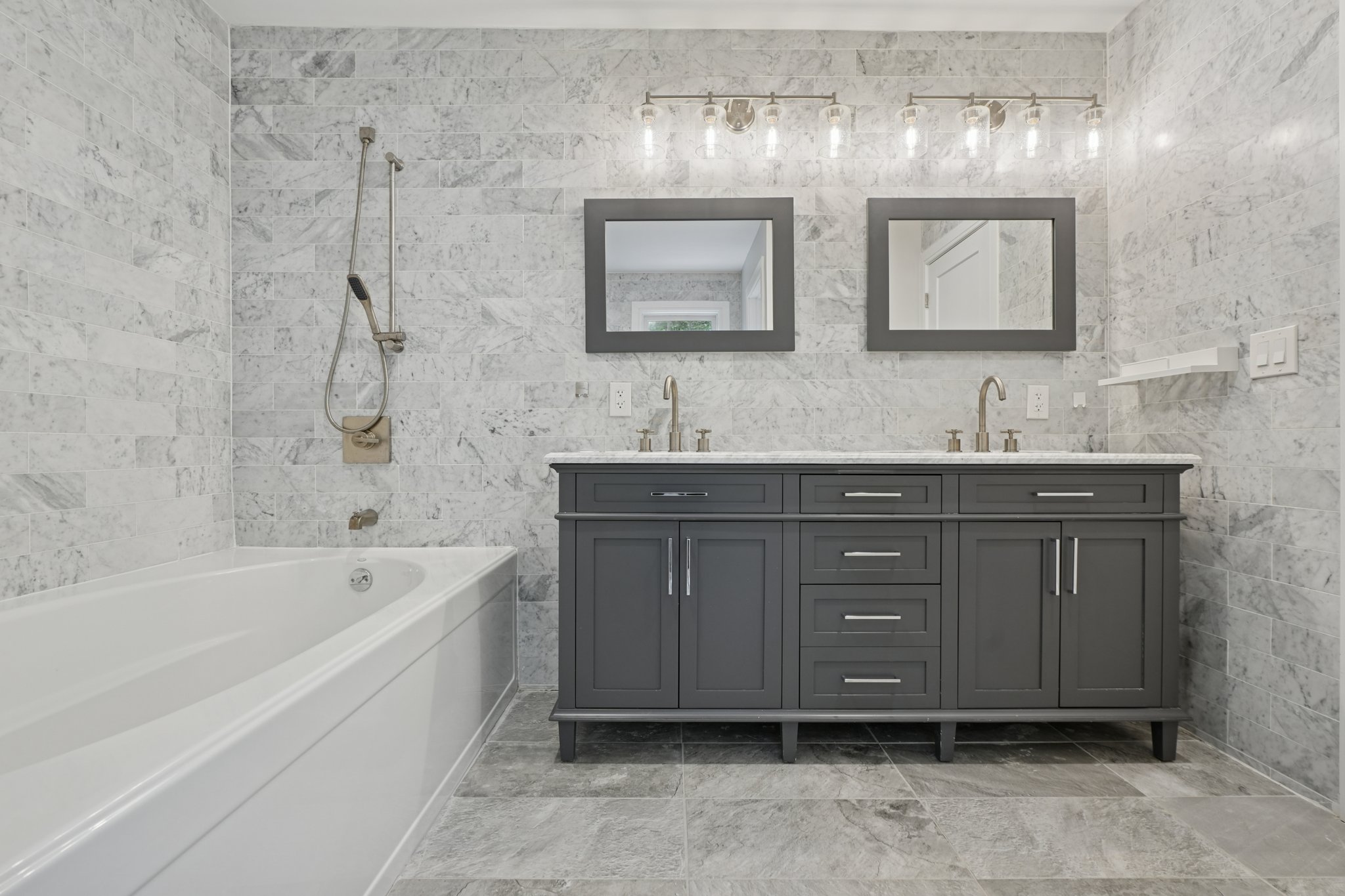 823 River Road Chatham, NJ 07928 - Photo 21 of 60 a bathroom with a double vanity sink mirror and bathtub