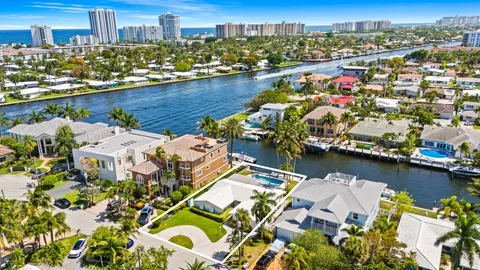 an aerial view of a house with a lake view