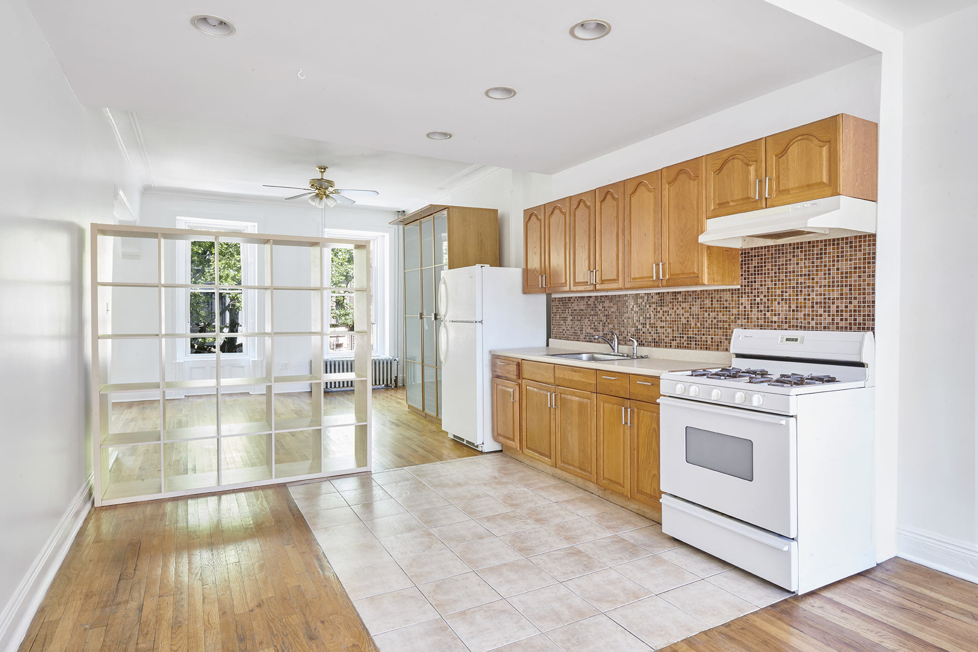 276 Stuyvesant Avenue, Unit 2 Brooklyn, NY 11221 - Photo 7 of 11 a kitchen with a sink and a stove top oven