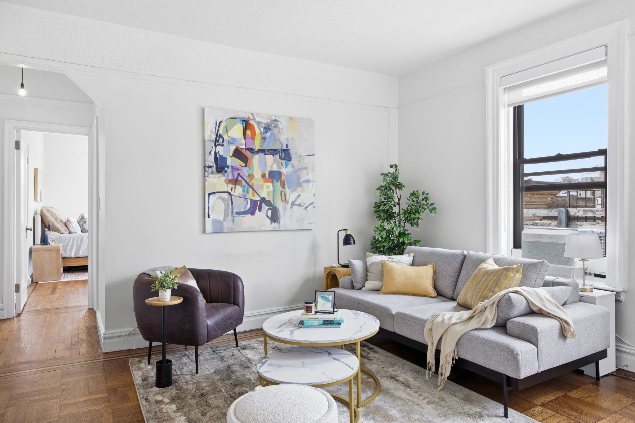 485 Central Park West, Unit 7A Manhattan, NY 10025 - Photo 2 of 15 a living room with furniture and a table
