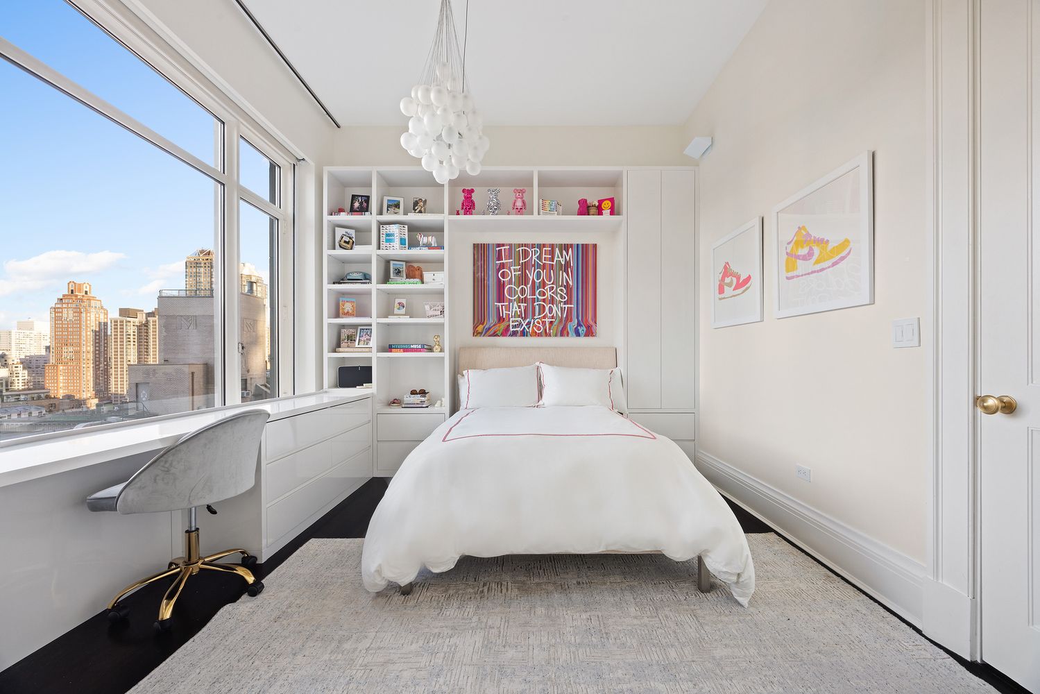 a bedroom with a bed and a large window