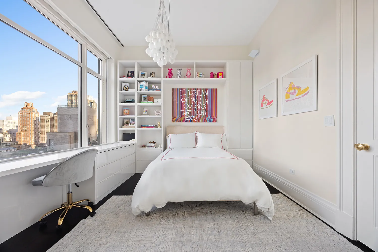 a bedroom with a bed and a large window