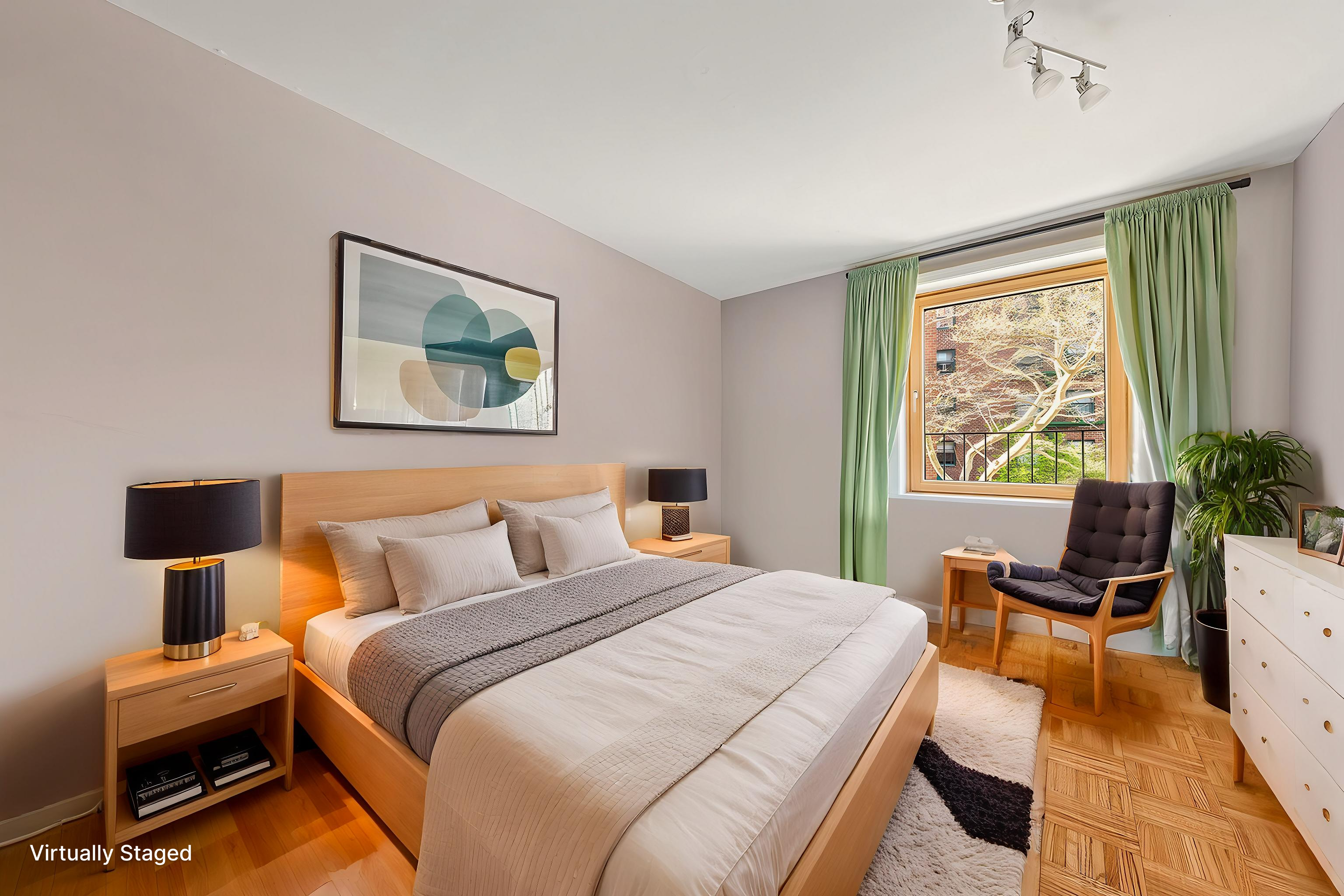 680 Washington Street, Unit 1B Manhattan, NY 10014 - Photo 8 of 13 a bedroom with a bed and a desk