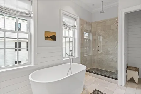 a bath room with a sink and a mirror